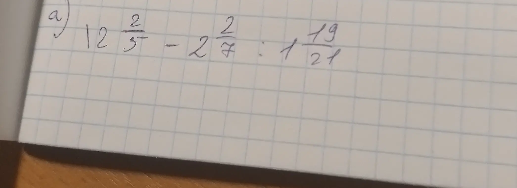 Помоги мне решить выражение $12\frac{2}{5} - 2\frac{2}{7} : 1\frac{19}{21}$