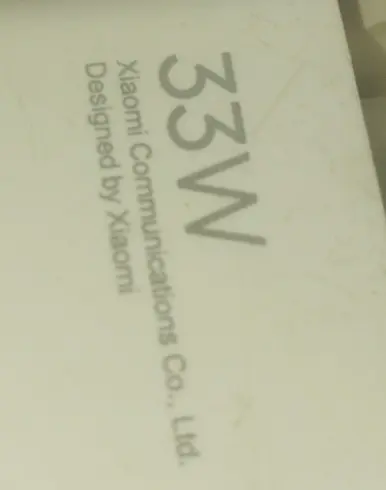 Что написано на картинке с надписью '33W Xiaomi Communications Co., Ltd. Designed by Xiaomi'?
