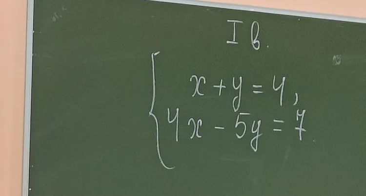 Решите систему уравнений: x + y = 4, 4x - 5y = 7.