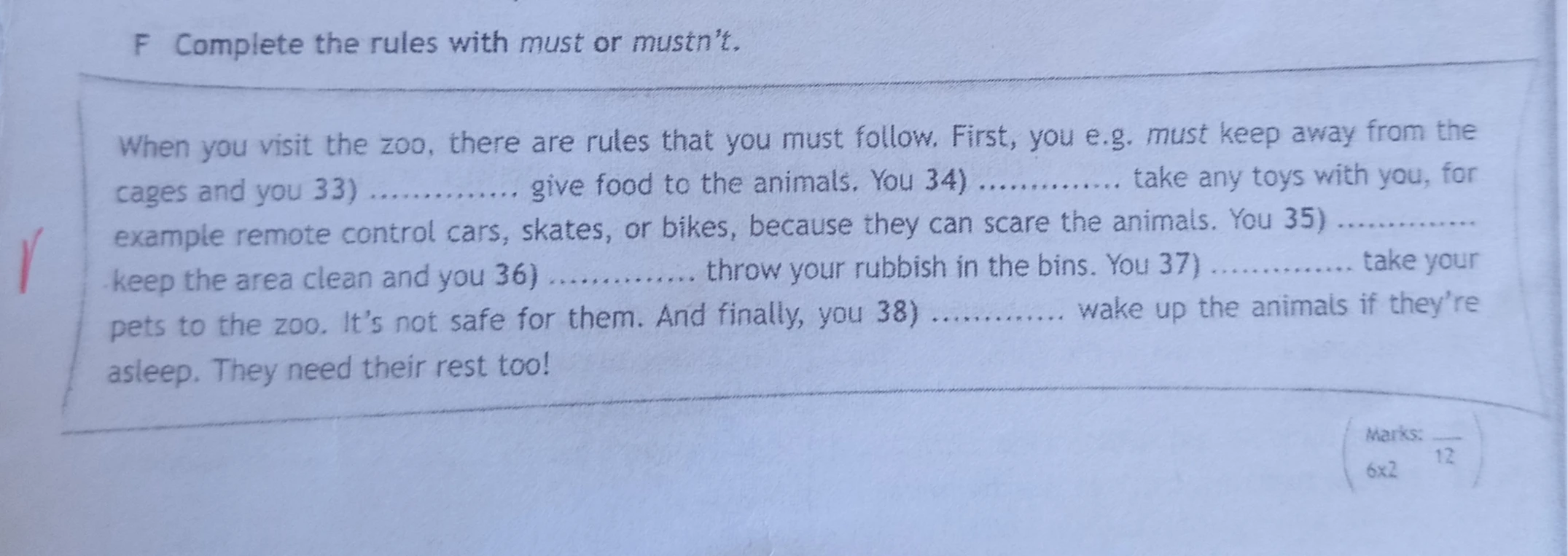 F Complete the rules with must or mustn't.