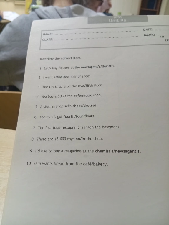 Underline the correct item. 1 Let's buy flowers at the newsagent's/florist's. 2 I want a/the new pair of shoes...