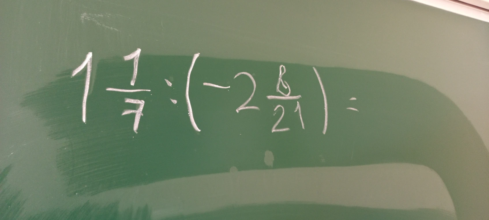 1 1/7 : (-2 8/21) =