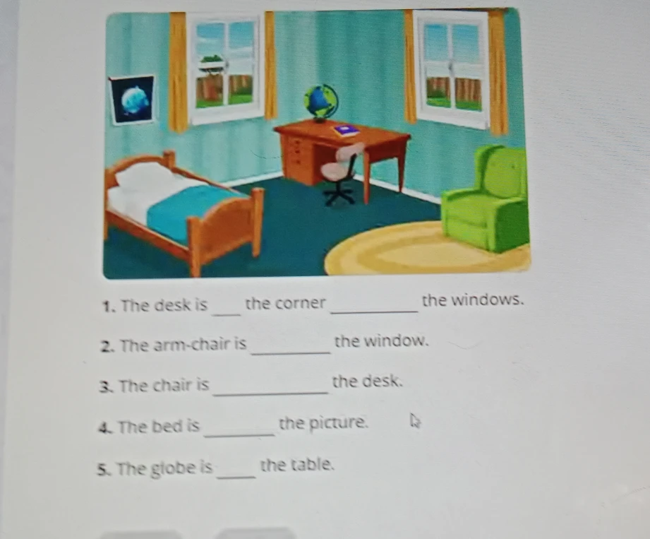 The desk is ___ the corner ___ the windows.