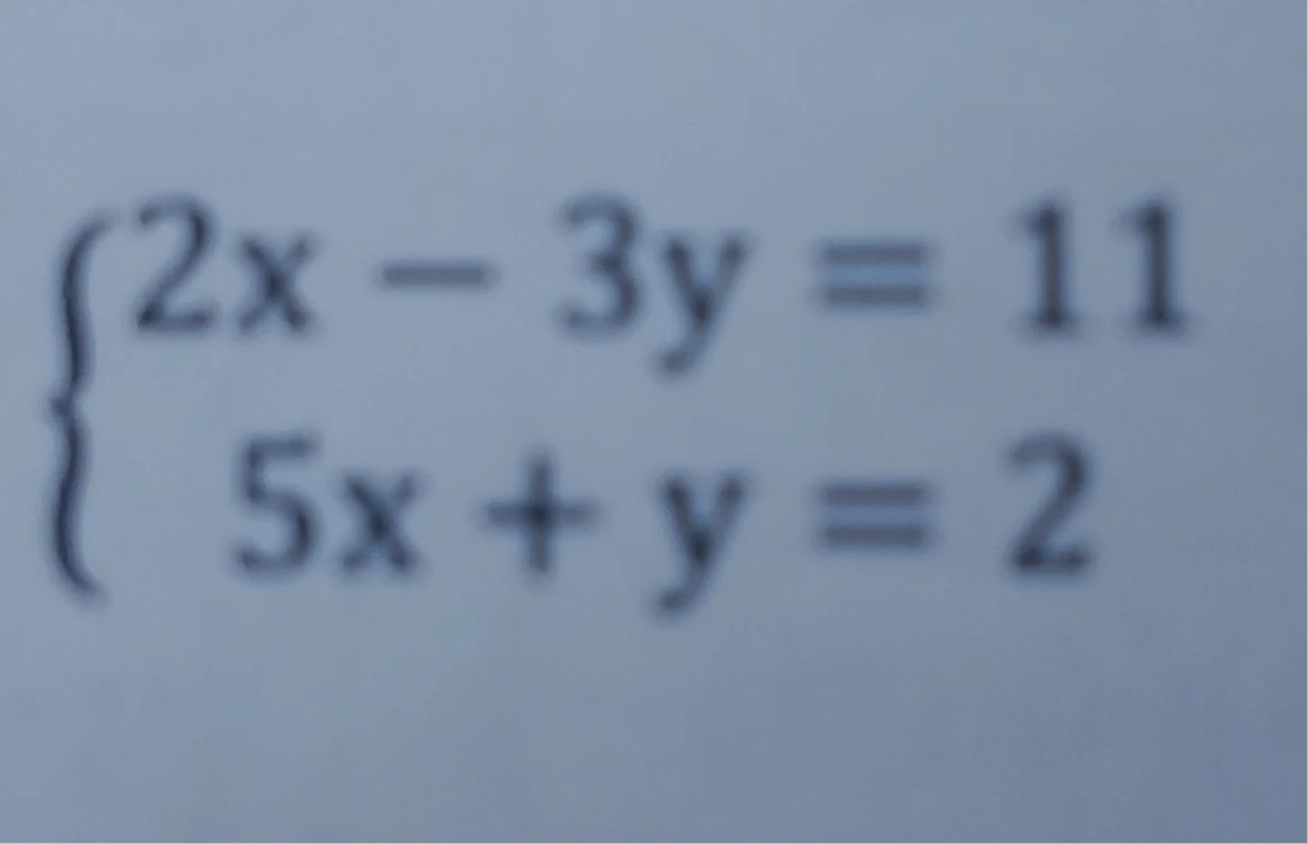 2x - 3y = 11 5x + y = 2