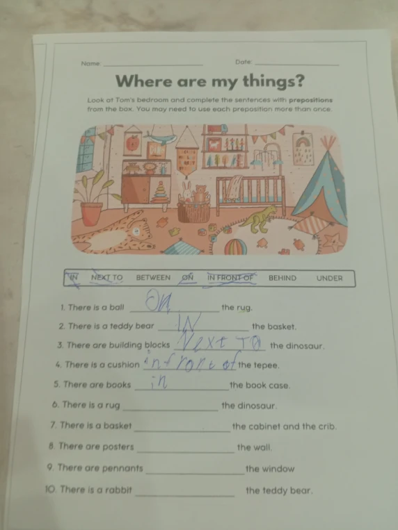 Where are my things? Look at Tom's bedroom and complete the sentences with prepositions from the box.