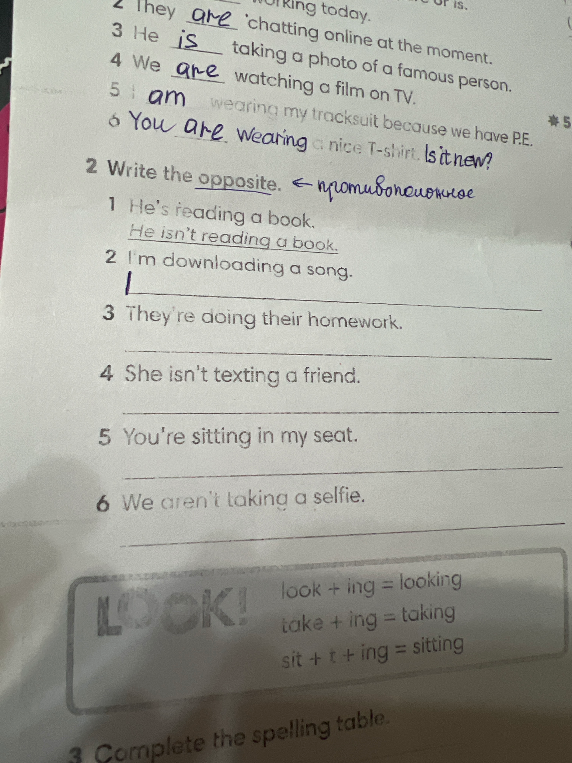 2 Write the opposite. 1 He's reading a book. He isn't reading a book. 2 I'm downloading a song.