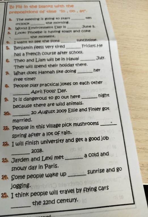 B) Fill in the blanks with the prepositions of time "in", "on", "at".